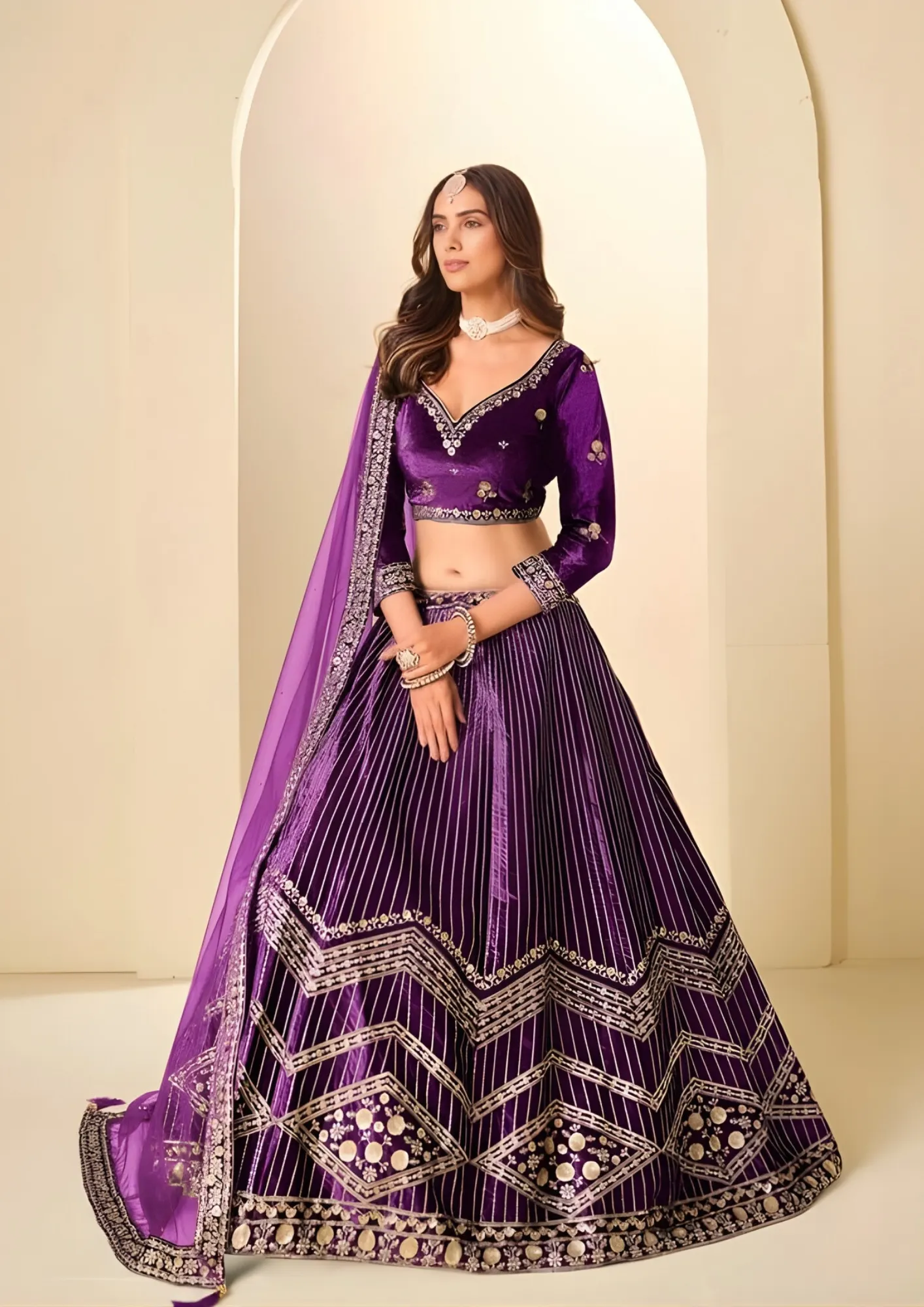 Women wearing traditional Indian ethnic lehenga-choli sets in pink, navy blue, and green with intricate embroidery and paisley patterns | Khusika ethnic fashion collection