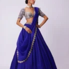 Persian blue organza lehenga with embroidered blouse featuring pearl and metallic embellishments for festive occasions