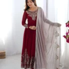 Woman wearing designer maroon anarkali suit with embroidery and sequence work, styled for wedding celebration photoshoot