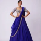 Intricate foil mirror work embellishment on royal blue lehenga creating a stunning festive and bridal aesthetic